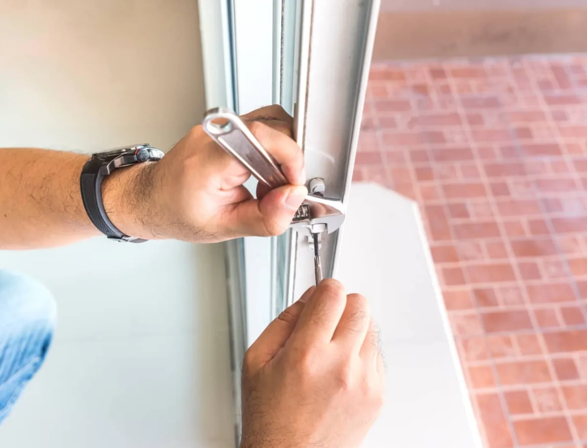 Locksmith replacing mortise lock on sliding glass patio door in South Florida home