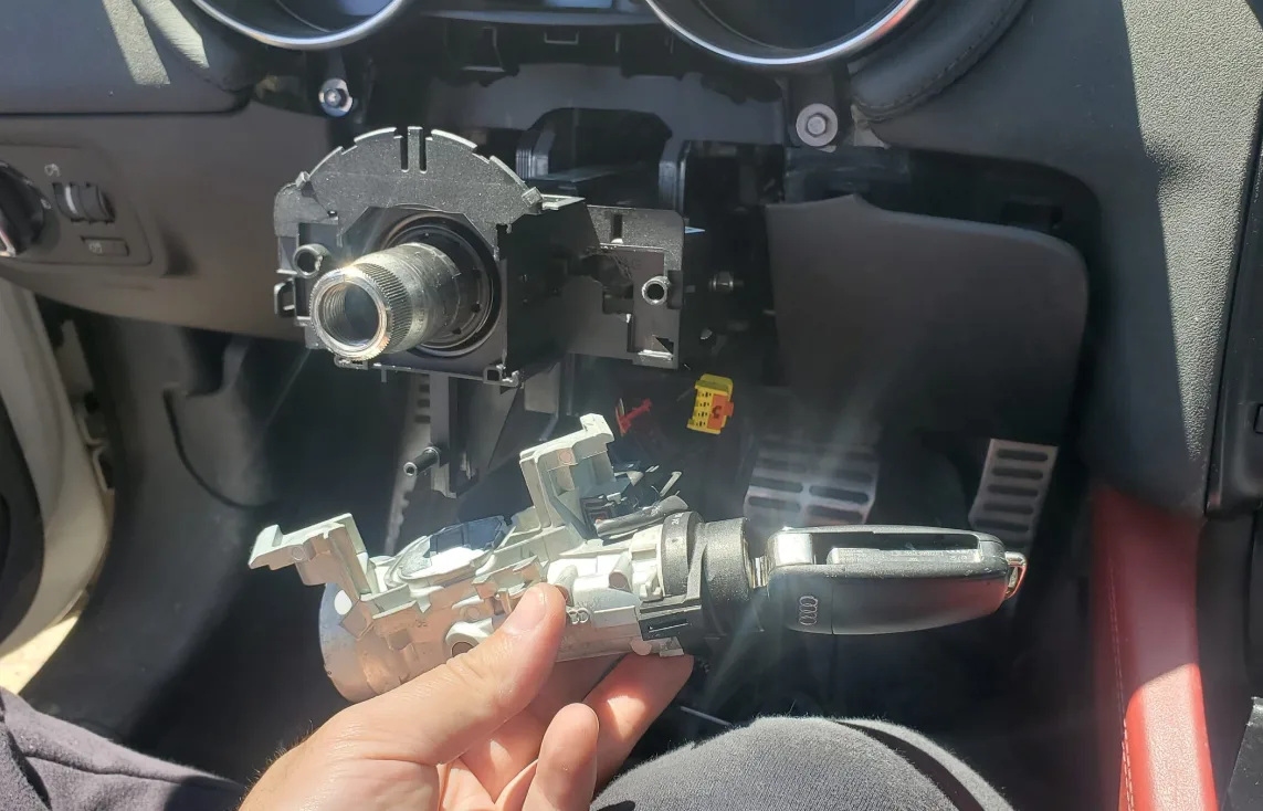 Ignition cylinder repair and replacement service by Triton Locksmith on vehicle steering column