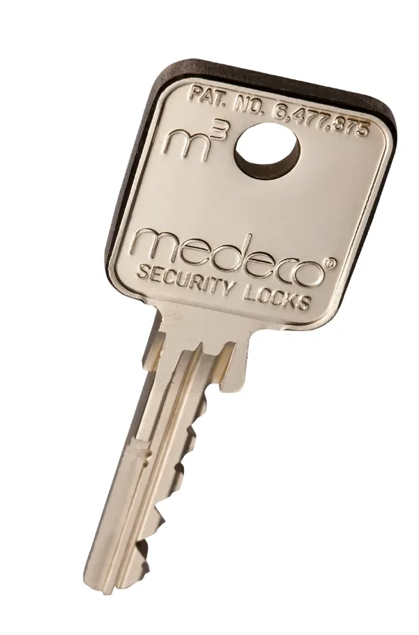 Triton Locksmith installing Mul-T-Lock restricted cylinder on commercial office door in Boca Raton